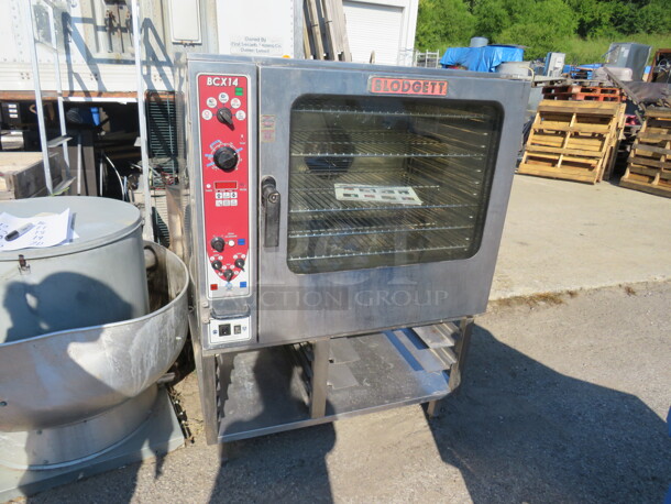 One Blodgett Full Size Electric Combi Oven With 5 Racks, And Manuals, On Stand. Model# BCX-14E. 208 Volt. 3 Phase. 40X41X56. $29,397.75. - Image 1 of 5