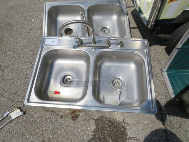 One SS Residential Double Bowl Sink With Faucet. 33X22 - Image 1 of 1
