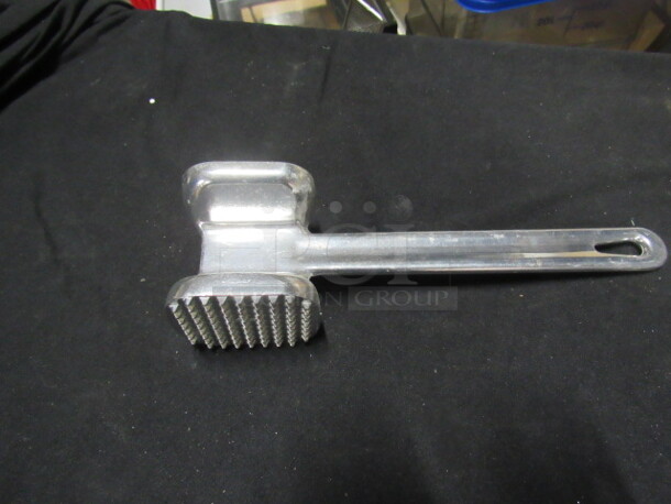 One NEW Meat Tenderizer.