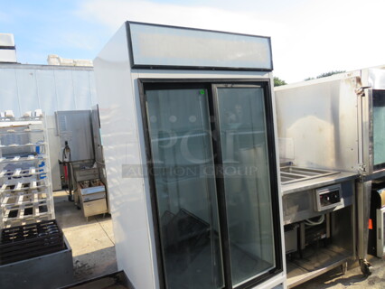 One Beverage Air 2 Glass Door Display Cooler With 6 Racks. Model# MT33. 115 Volt. 39X30X78.5