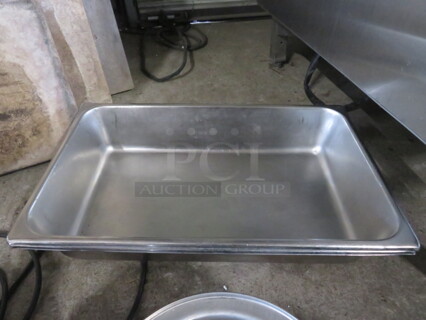 One Full Size 4 Inch Deep Hotel Pan.