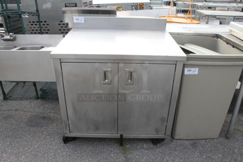 Stainless Steel Commercial Counter w/ Back Splash, Under Shelves and 2 Doors.