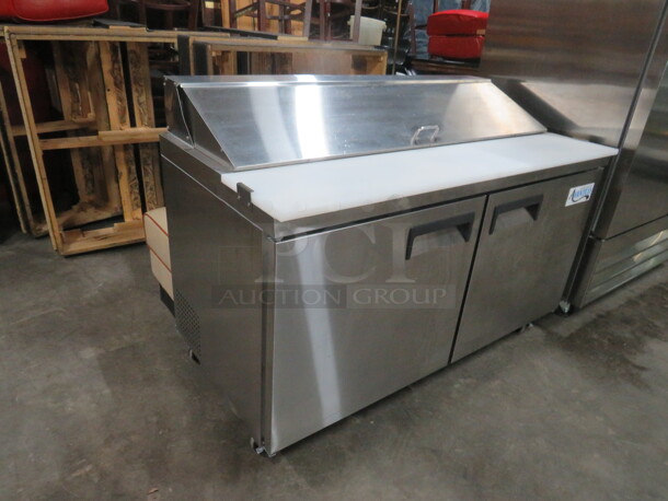 One Working Avantco 2 Door Refrigerated Prep Table With 2 Racks, And  Cutting Board On Casters. Model# 178APT60HC. 115 Volt. 60X31X43. - Image 2 of 5