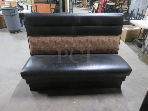 One Single Sided Booth With Black Cushioned Seat And Back. 60X25X42