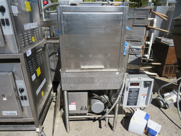 One Hobart Dish Machine With Heater Booster #MCH-10-2. 200/230 Volt. 3 Phase. 40X28X66. Model# AM-14