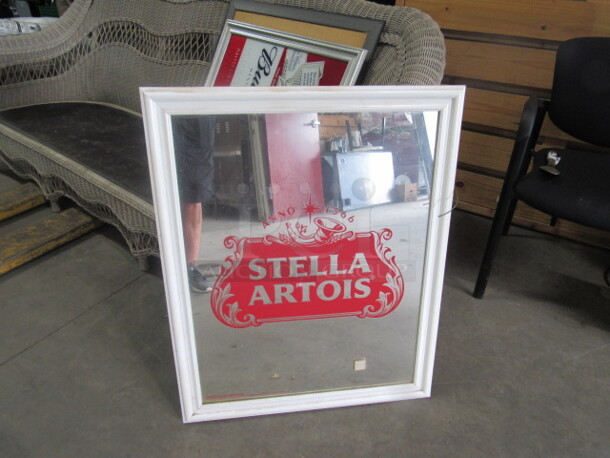 One 26X32 Stella Artois Framed Mirror.