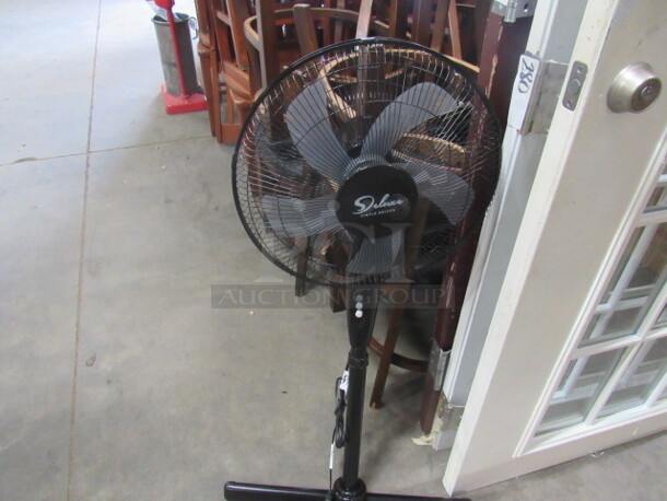 One Deluxe Simple Deluxe Stand Fan. 