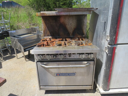 One Bakers Pride Natural Gas 6 Burner Range With 2 Racks.  #36BP6BS3ON. 36X33X56