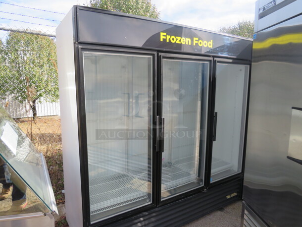 One True 3 Door Glass Display Freezer With 8 Racks On Casters. Model#GDM-72F-LD. 115/208-230 Volt. 1 Phase. 