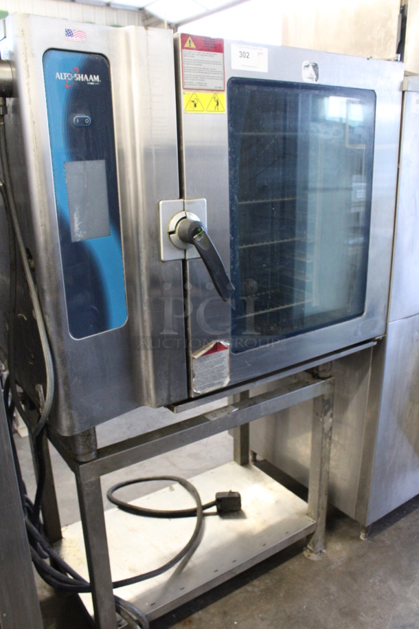 2013 Alto Shaam Model 10.10 ESI Stainless Steel Commercial Electric Powered Combitherm Convection Oven w/ View Through Door and Metal Oven Racks on Stainless Steel Equipment Stand. 208-240 Volts, 3 Phase. 46x32x67