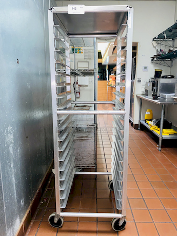 ALMOST PERFECT! Lockwood RA64-ER18ES Intermediate Height 18 Level 64" End Load Rack.
Condition: 8/10 
A hard working, versatile line of racks
Construction: High tensile extruded aluminum
Dimensions: 64"H x 21 3/8"W x 26 1/2"D
Tray supports: 1-1/2″ wide extruded pan supports riveted to uprights
Center Spacing: 3"
Pan Capacity: (18) 18" x 26" pans
Casters: 5" non-marking swivel threaded stem
Actual Weight: 45 lbs. - Image 1 of 6