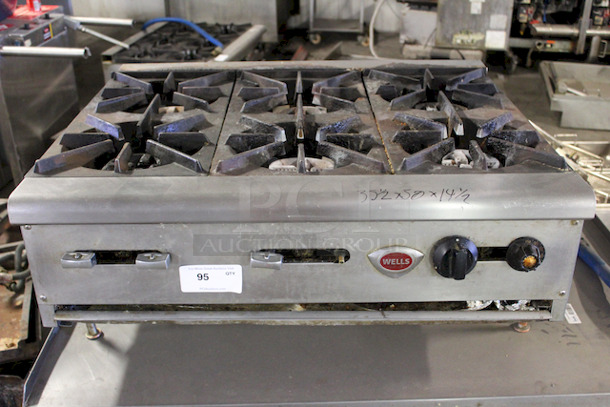 Wells 36” (6) Burner Range, Counter Top on Stainless Steel Equipmnet Stand With Commercial Casters, Natural Gas. 