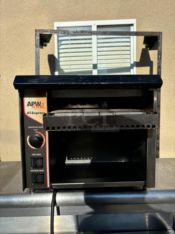 APW AT EXPRESS Conveyor Toaster - 300 Slices/hr w/ 1 1/2" Product Opening, 120v
 - Image 1 of 5