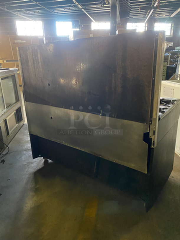 Commercial Natural Gas Powered 4 Burner Stove! With Built In Flat Top Grill! With Back Splash And Salamander Shelf! With Full Size Oven! Metal Oven Rack! With 2 Door Storage Area Underneath! All Stainless Steel! - Image 4 of 12