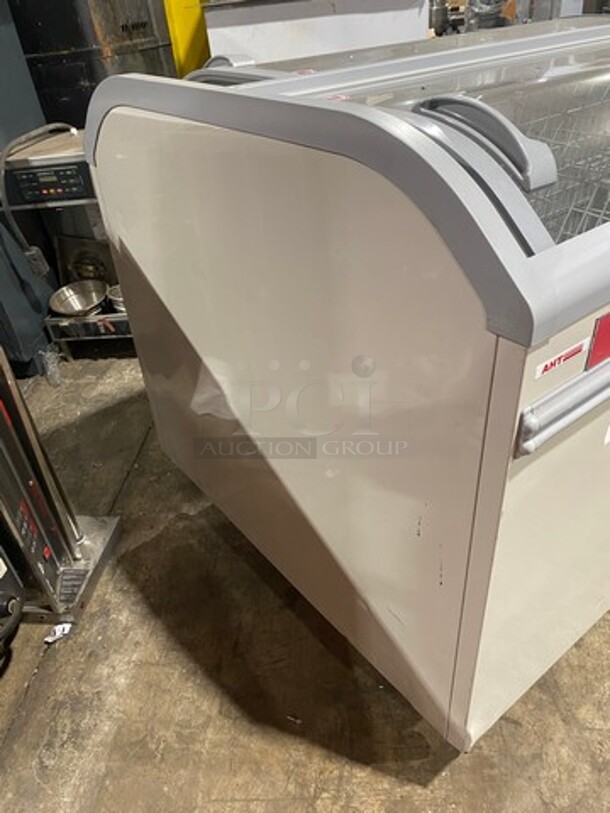 2016 AHT Chest Freezer Merchandiser! Model Manhattan210VS Serial 34990700000059! 110-120V 1Phase! With Baskets! One Glass Door Missing! On Legs!
 - Image 2 of 9