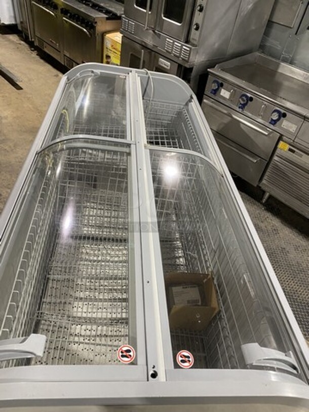 2016 AHT Chest Freezer Merchandiser! Model Manhattan210VS Serial 34990700000059! 110-120V 1Phase! With Baskets! One Glass Dor Missing! On Legs!  - Image 5 of 10