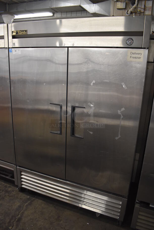 2013 True T-49F ENERGY STAR Stainless Steel Commercial 2 Door Reach In Freezer w/ Poly Coated Racks on Commercial Casters. 115 Volts, 1 Phase. 54x30x83. Tested and Working!