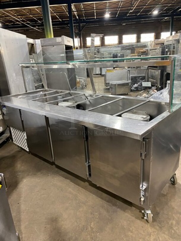 ALL STAINLESS-STEEL  96 Inch Refrigerated Sandwich Prep Table! With Sneeze Guard! With 3 Door Under Refrigeration! Sandwich Prep Area w/ 7 Compartments! 115V 1 Phase! On Casters!
 - Image 4 of 7