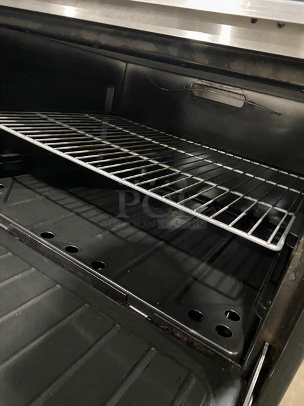 AMAZING! Garland Commercial Natural Gas Powered 6 Burner Split Top With Right Side Flat Griddle! With 2 Full Ovens Underneath! With Back Splash & Overhead Salamander Shelf! All Stainless Steel! With Metal Oven Racks! On Casters!  - Image 9 of 12
