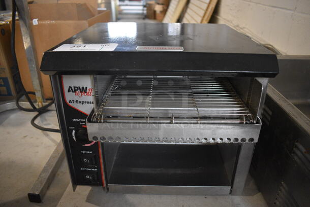 APW Wyott Model AT EXPRESS Stainless Steel Commercial Countertop Electric Powered Conveyor Toaster Oven. 120 Volts, 1 Phase. 15x17x13. Tested and Working! - Image 1 of 4