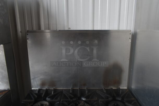 Garland SunFire Stainless Steel Commercial Natural Gas Powered 6 Burner Range w/ Oven and Back Splash on Commercial Casters.  - Image 3 of 8