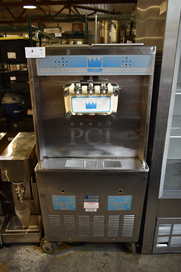 Taylor 754-33 Stainless Steel Commercial Floor Style Water Cooled 2 Flavor w/ Twist Soft Serve Ice Cream Machine on Commercial Casters. 208-230 Volts, 3 Phase.