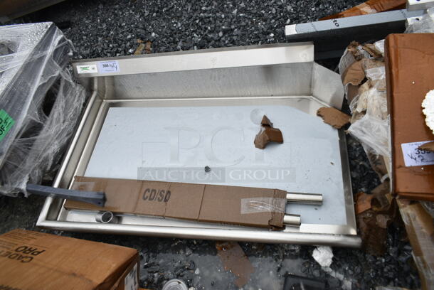 BRAND NEW SCRATCH AND DENT! Regency 600CDT48L 24" x 30" 16-Gauge 304 Stainless Steel Commercial Open Base Work Table - Image 2 of 4