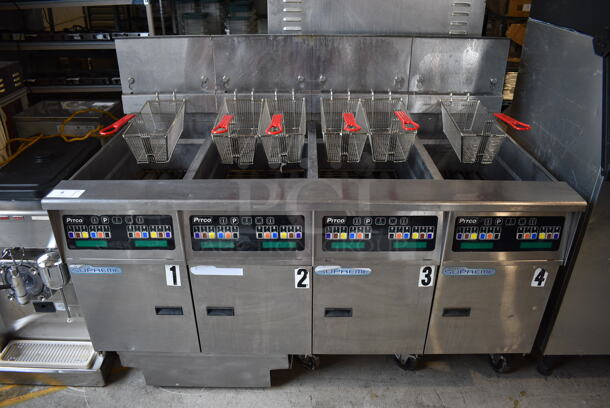 2014 Pitco Frialator Model SSH60 ENERGY STAR Stainless Steel Commercial 4 Bay Natural Gas Powered Deep Fat Fryer w/ 6 Metal Fry Baskets and Filtration System on Commercial Casters. 80,000 BTU. 62.5x35x49