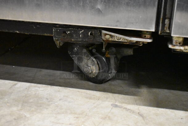 True TG2R-2S ENERGY STAR Stainless Steel Commercial 2 Door Reach In Cooler w/ Poly Coated Racks on Commercial Casters. 115 Volts, 1 Phase. Tested and Working! - Image 4 of 8