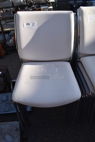 31 White Dining Chairs on Chrome Finish Metal Frame. 20x22x35. 31 Times Your Bid!