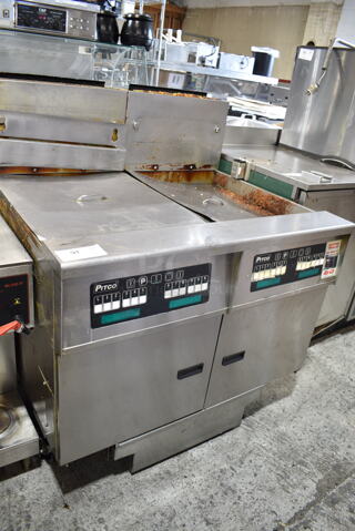 Pitco Frialator SSH60W Stainless Steel Commercial Floor Style Natural Gas Powered Deep Fat Fryer w/ Filtration System on Commercial Casters. 100,000 BTU. 