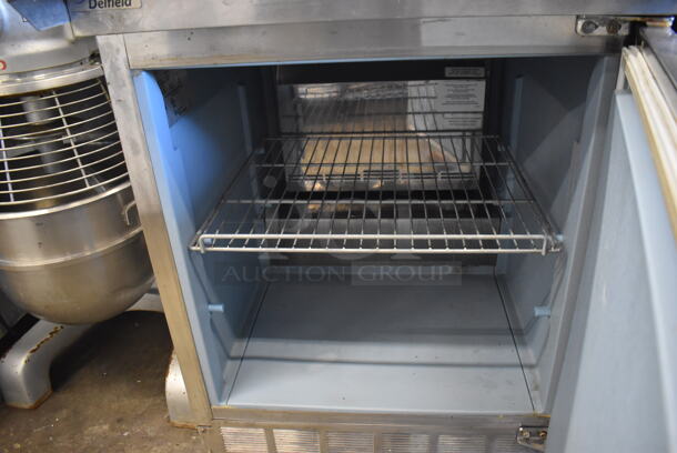 2011 Delfield 4427N-12M Stainless Steel Commercial Sandwich Salad Prep Table Bain Marie Mega Top on Commercial Casters. 115 Volts, 1 Phase. 27.5x33x45. Tested and Powers On But Temps at 50 Degrees - Image 6 of 6