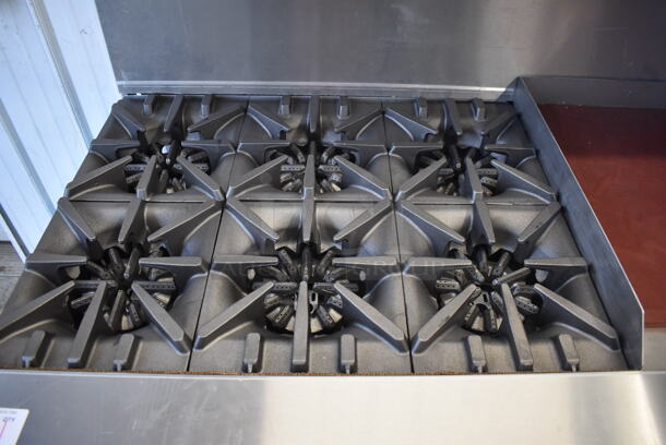 BRAND NEW SCRATCH AND DENT! Garland G60-6G24RR Stainless Steel Commercial Natural Gas Powered 6 Burner Range w/ Right Side Flat Top Griddle, 2 Ovens, Over Shelf and Back Splash. Missing 1 Leg and 1 Leg Is Bent. 310,000 BTU. 59x34x59. Tested and Working! - Image 4 of 11