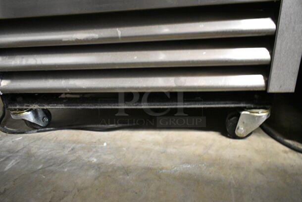 2016 True T-19F Stainless Steel Commercial Single Door Reach In Freezer w/ Poly Coated Racks and Commercial Casters. 115 Volts, 1 Phase. Tested and Working! - Image 4 of 8