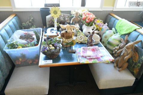 Wall Mount Table w/ Contents Including Spring Decor. BUYER MUST REMOVE: Bring Tools and Manpower Needed To Remove This Item. (booth room) 