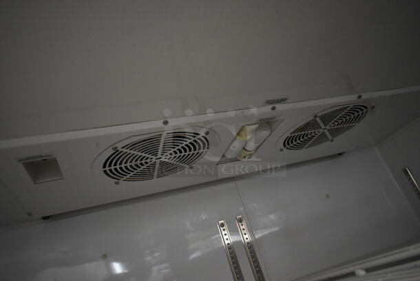 2014 True TG2R-2S ENERGY STAR Stainless Steel Commercial 2 Door Reach In Cooler w/ Poly Coated Racks on Commercial Casters. Doors Need To Be Reattached. 115 Volts, 1 Phase. Tested and Powers On But Does Not Get Cold - Image 7 of 8