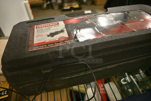 ALL ONE MONEY! Tier Lot of Various Items Including Steel Floor Jack with Case, Tool Kit, Light Bulbs, and Gloves - Image 3 of 7