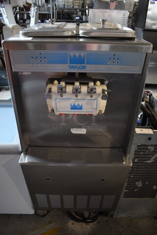 Taylor Model 339-33 Stainless Steel Commercial Floor Style 2 Flavor w/ Twist Soft Serve Ice Cream Machine on Commercial Casters. 208-230 Volts, 3 Phase. 26x34x60