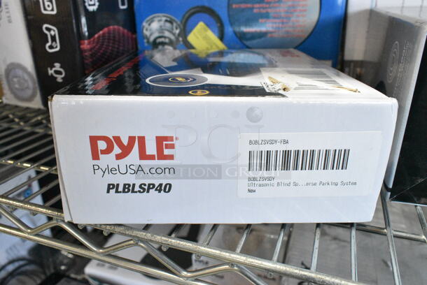 12 IN ORIGINAL BOX! Items Including 2 Pyle PPBCM92 HD Body Camera, Knox Gear TX 100 Closed Back Studio Monitor Headphones, Pyle PLBLSP40 Back Up Camera, SereneLife Electric Air Pump Compressor Air Inflator, Pyle PLIO90BL High Power Subwoofer,  Pyle Desktop USB Podcast Microphone Kit PDMIKT140, 2 Pyle PL63BL Speakers Blue, Pyle PMXU83BT 8-Channel Bluetooth Studio Mixer, SereneLife SLSBIN21 Security Locking Storage Container Bin, Honeywell 4 Liter Mini Fridge, Windowfan. 12 Times Your Bid!  - Image 5 of 12