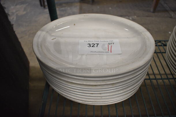 11 White Ceramic Oval Plates. 11.5x9x1. 11 Times Your Bid!