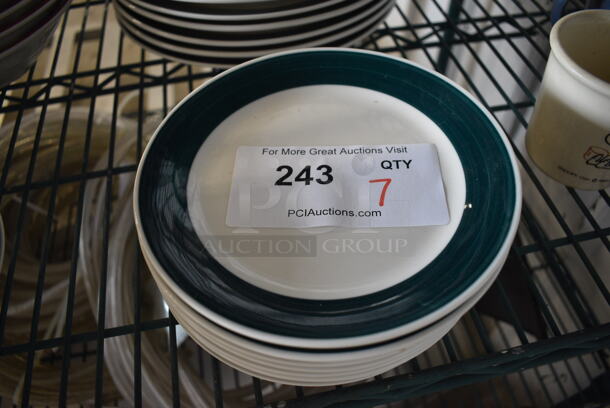 7 White Ceramic Plates w/ Green Line on Rim. 7x7x1. 7 Times Your Bid!