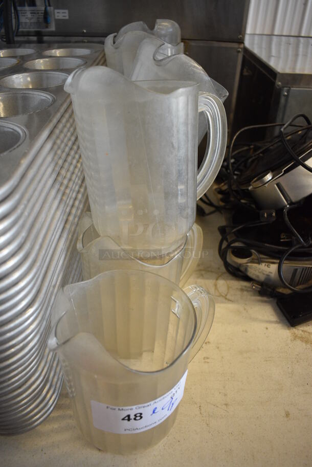ALL ONE MONEY! Lot of 9 Clear Poly Pitchers. 5x7.5x8