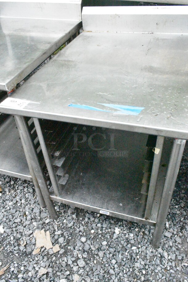 Stainless Steel Table w/ Back Splash and Under Shelf.  - Image 1 of 4