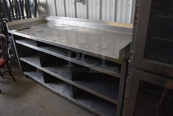 Stainless Steel Table w/ Back Splash and 3 Under Shelves. 75x30x40.5