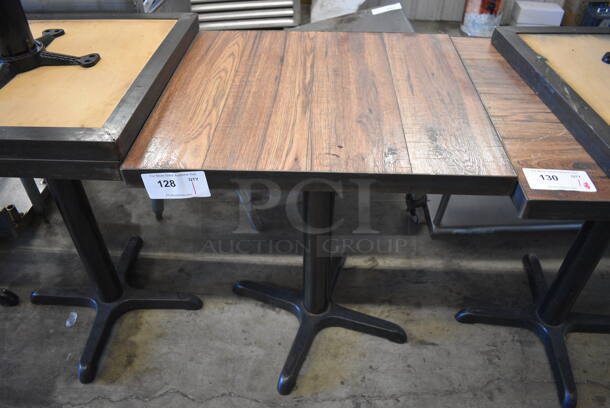 Wood Pattern Dining Height Table on Black Metal Table Base. Stock Picture - Cosmetic Condition May Vary. 22x24x30