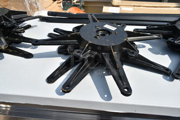 BRAND NEW SCRATCH AND DENT! Lot of 19 Lancaster Table and Seating Items Including 164TB5222 5" x 22" Straight Cast Iron Table Base Plate, 164STS1000 Cast Iron Table Base Spider, 9 164TS1800 18" Cast Iron Table Base Spider and 4 Metal Legs.  - Image 10 of 12