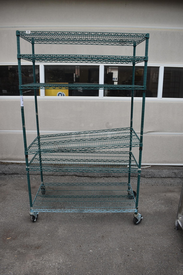Wire Shelving Unit With 5 Polycoated Shelves In Green on Commercial Casters. 