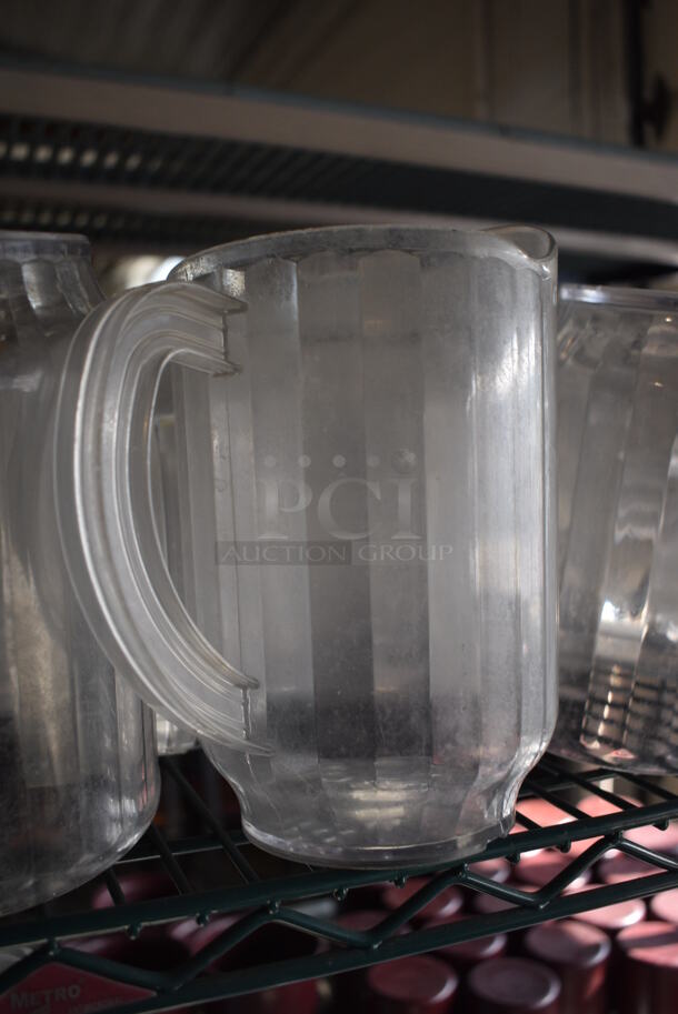 ALL ONE MONEY! Lot of 16 Clear Poly Pitchers! 7x5x8 - Image 3 of 4