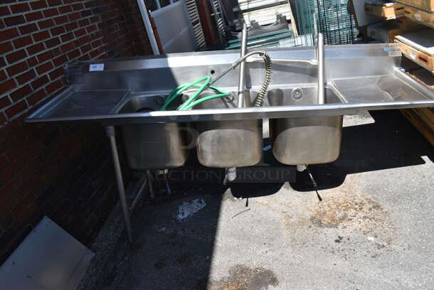 Stainless Steel Commercial 3 Bay Sink w/ Dual Drainboards, Handles, Faucet and Spray Nozzle. Legs Need To Be Attached. 89x26x44. Bays 16x20x14. Drainboards 20x22x2