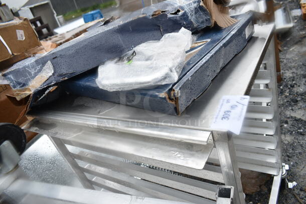 BRAND NEW SCRATCH AND DENT! Regency 600UPR8WTELS 8 Pan End Load Aluminum Undercounter Bun / Sheet Pan Rack with Stainless Steel Top and Side Channel - Image 6 of 7